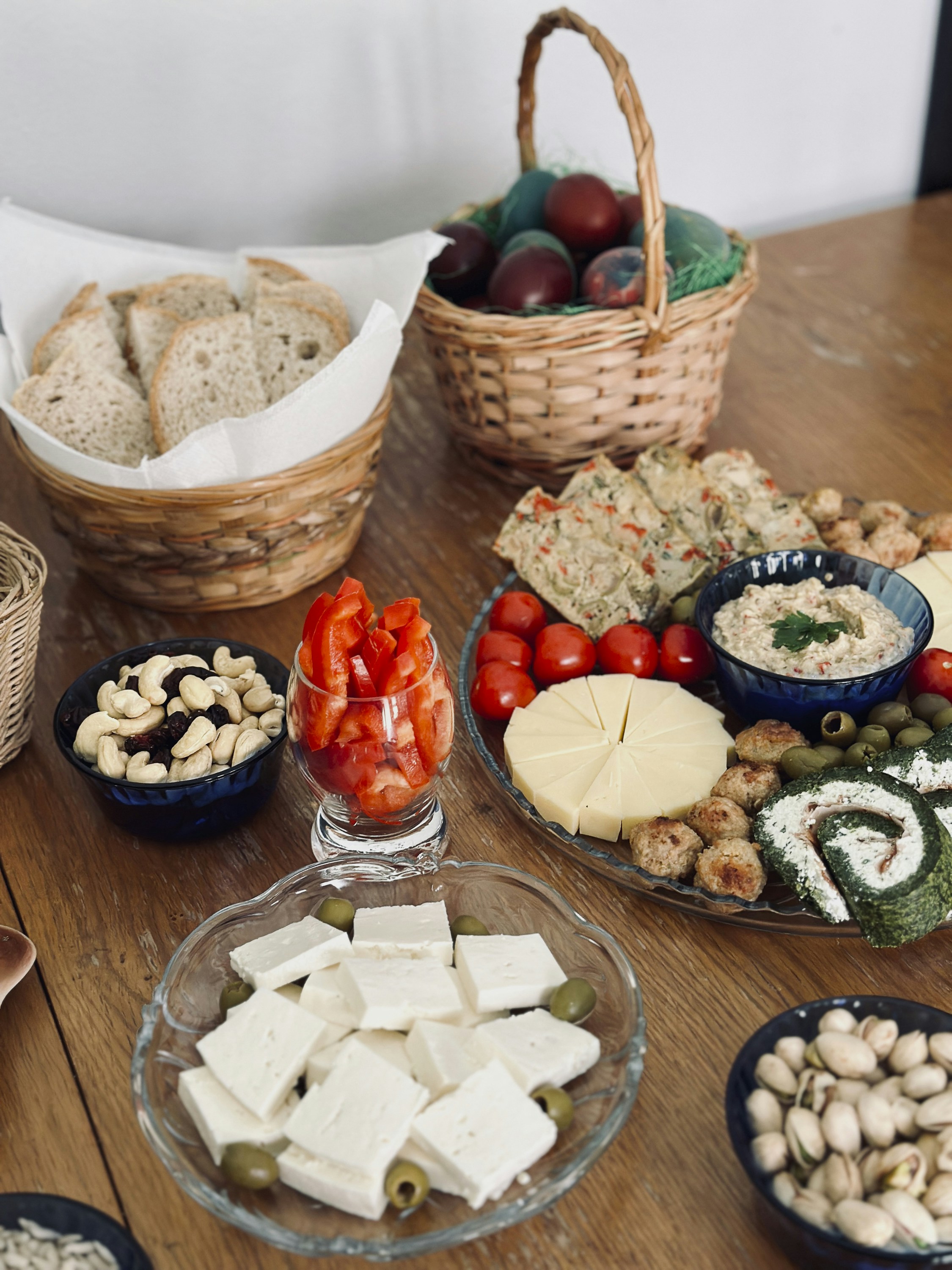 a wooden table topped with plates of food