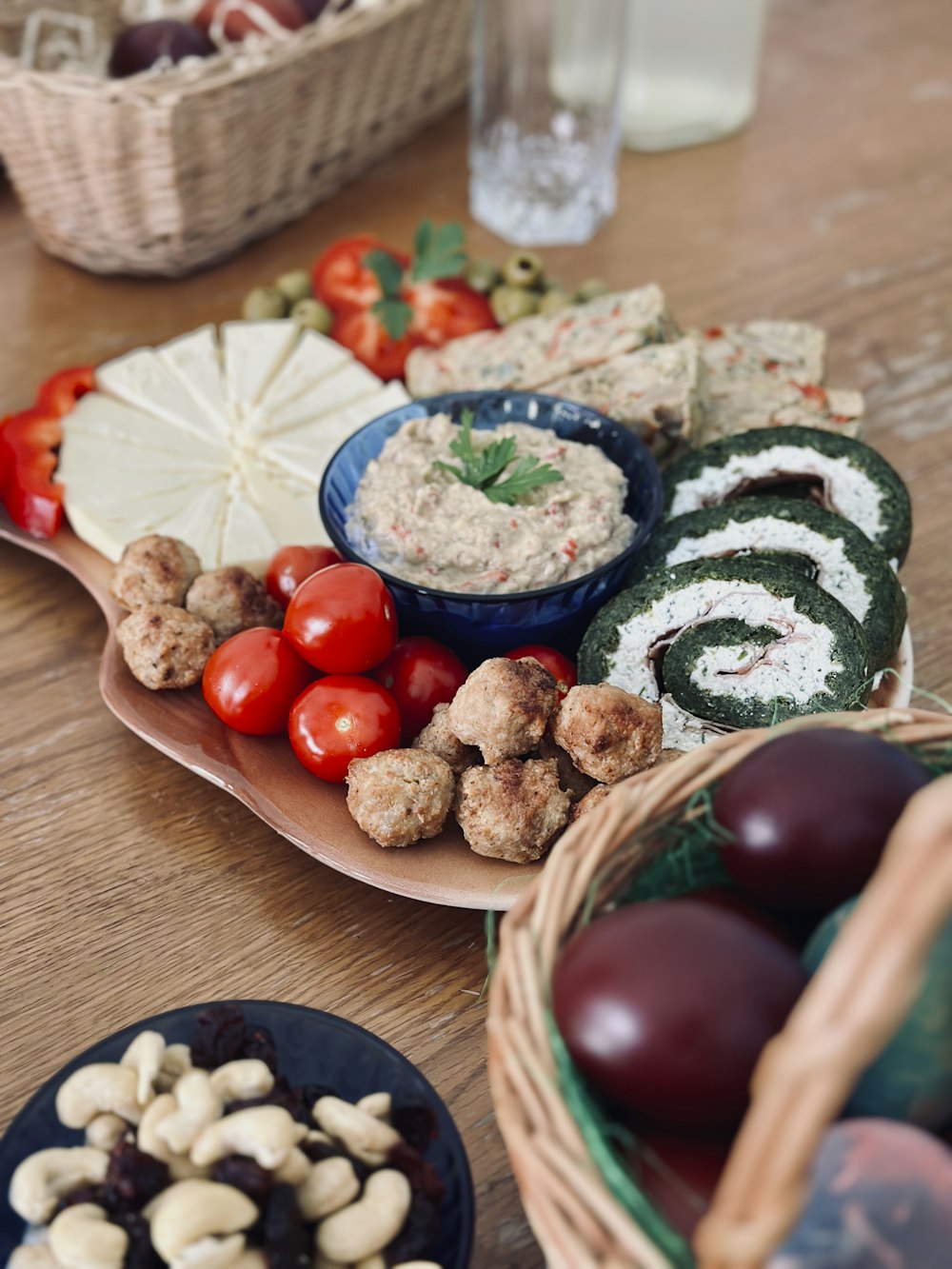 a wooden table topped with plates of food