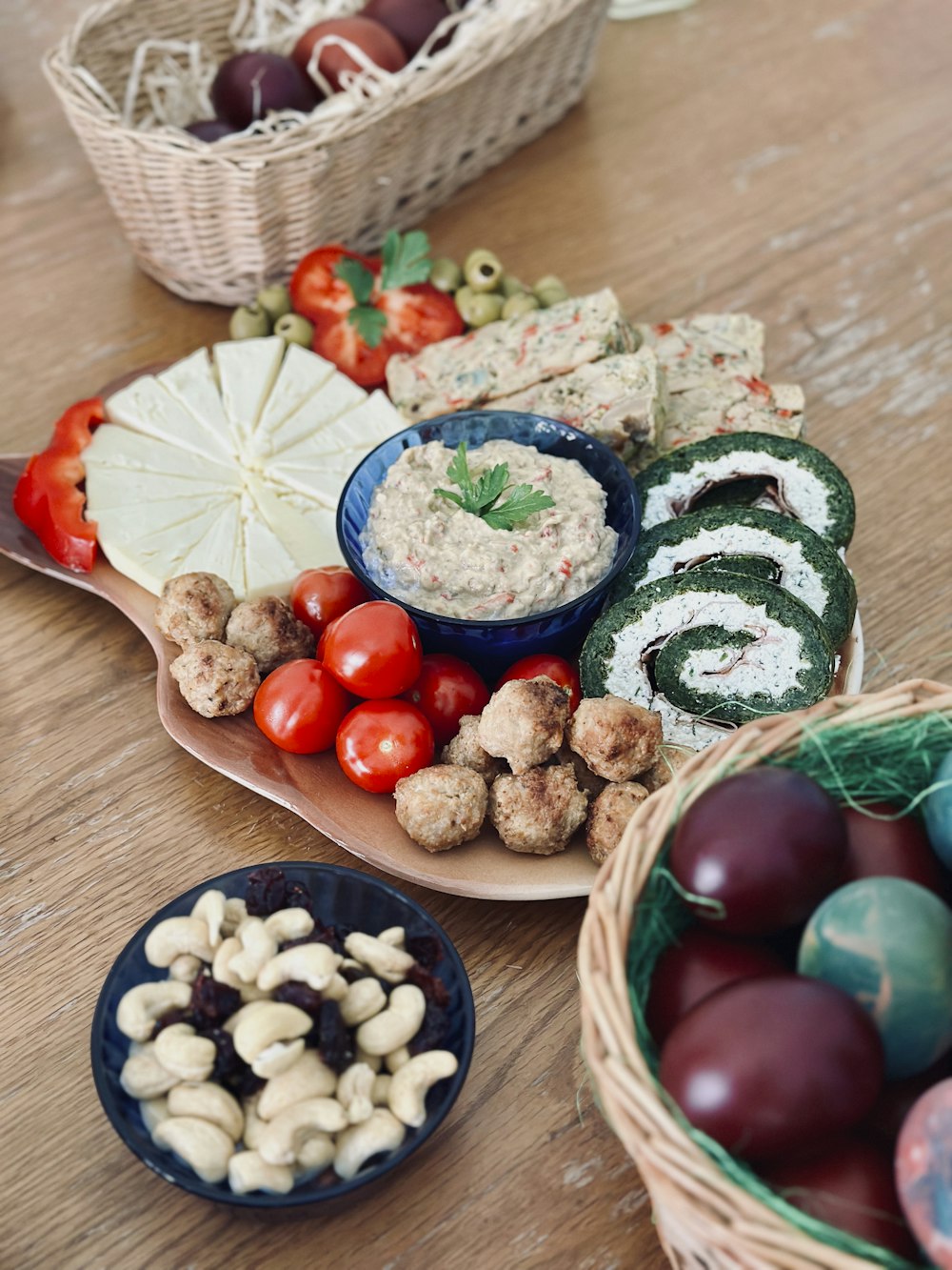 a wooden table topped with plates of food