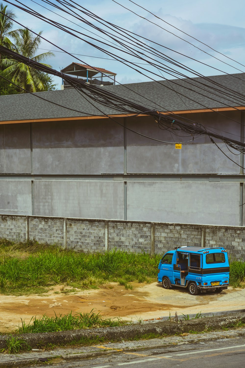 a blue truck parked in front of a building