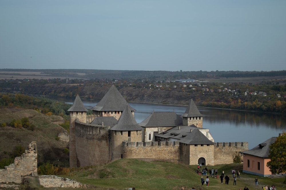 a castle with a lake in the background