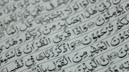 a close up of arabic writing on a piece of paper