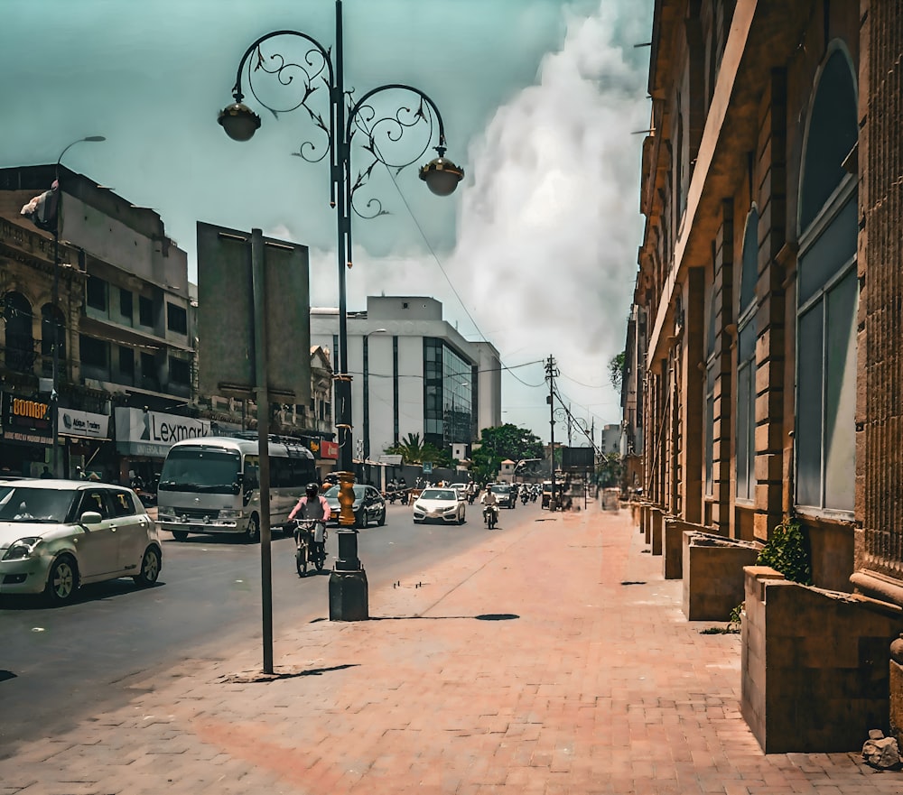 a city street filled with lots of traffic next to tall buildings