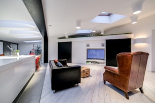 a living room filled with furniture and a flat screen tv