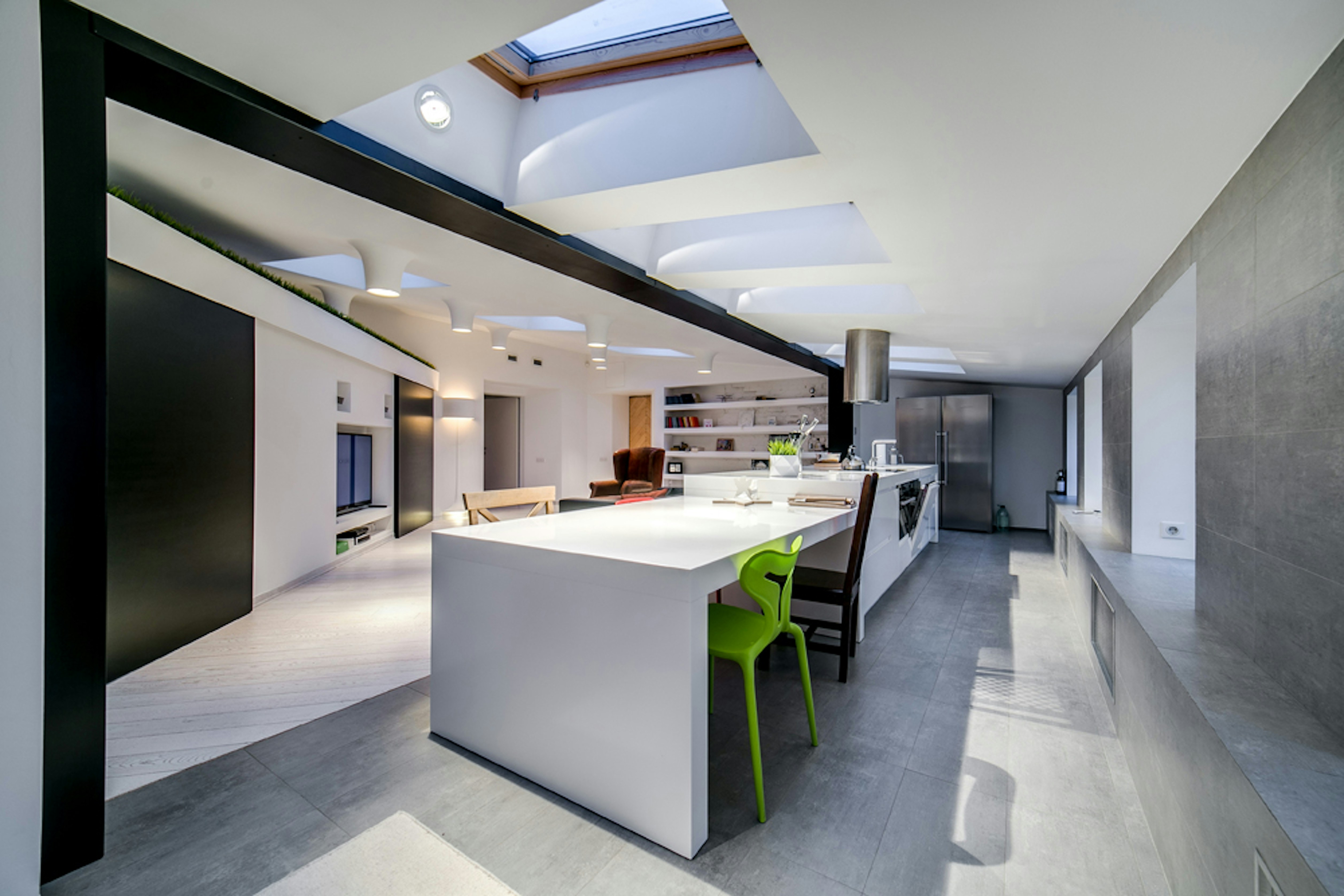 Modern kitchen with a large island and efficient layout - Interior Home Renovation