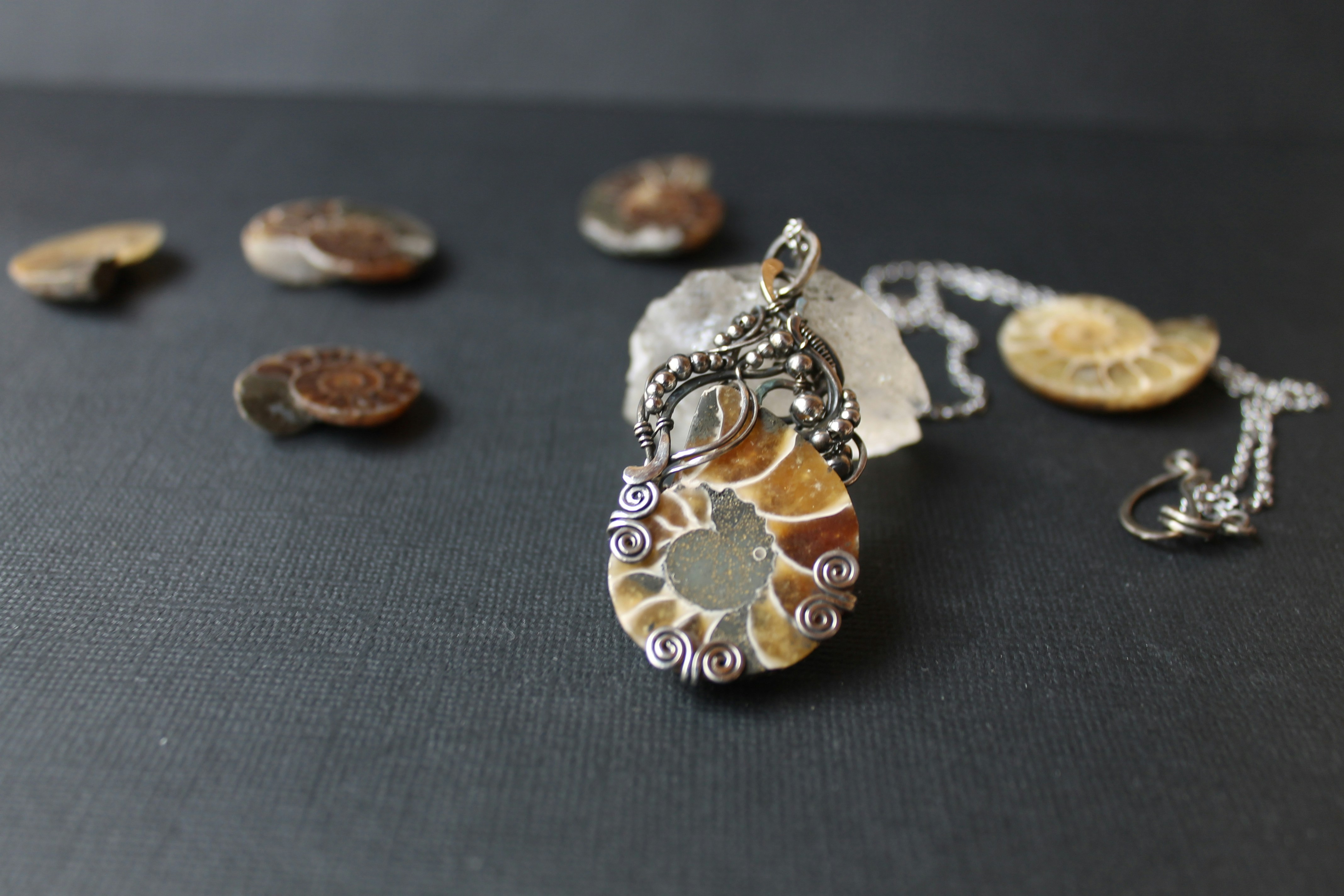 a close up of a necklace on a table