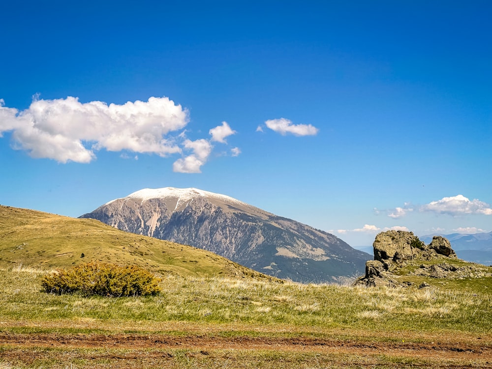 a mountain with a snow capped peak in the distance