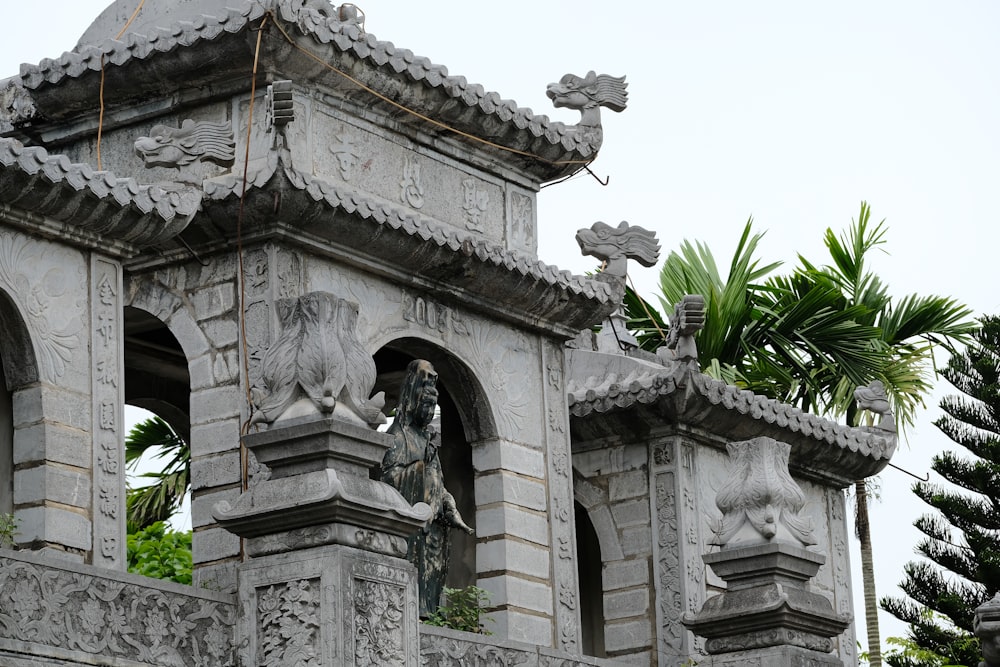 a statue of a lion on top of a building