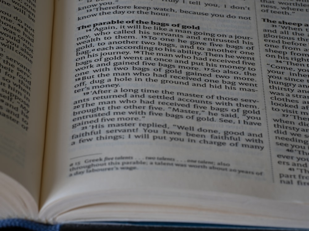 a close up of an open book on a table