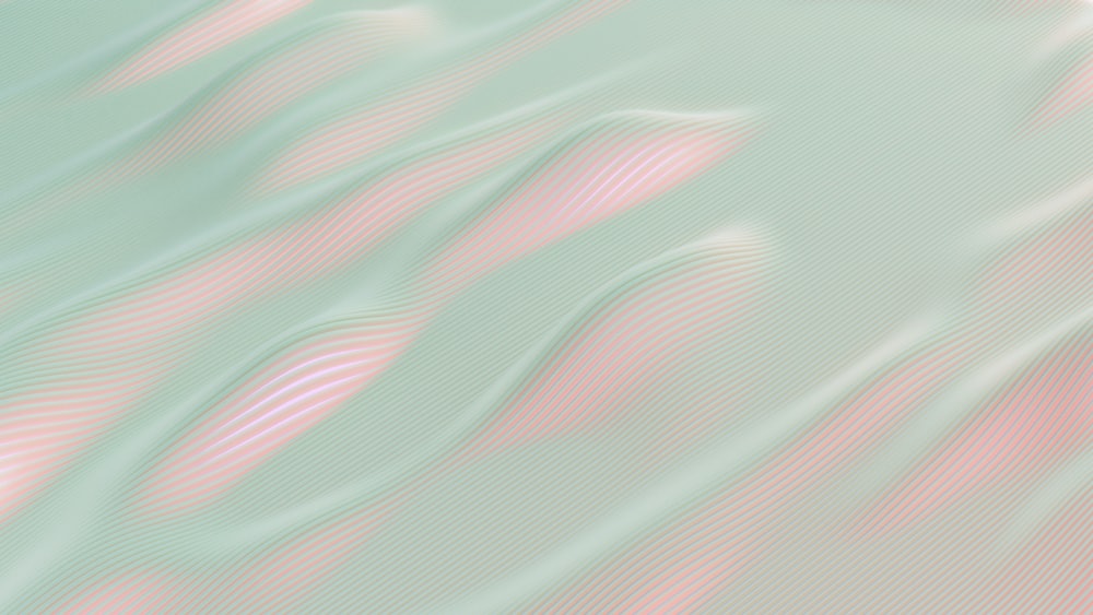 a blurry image of a pink and green background