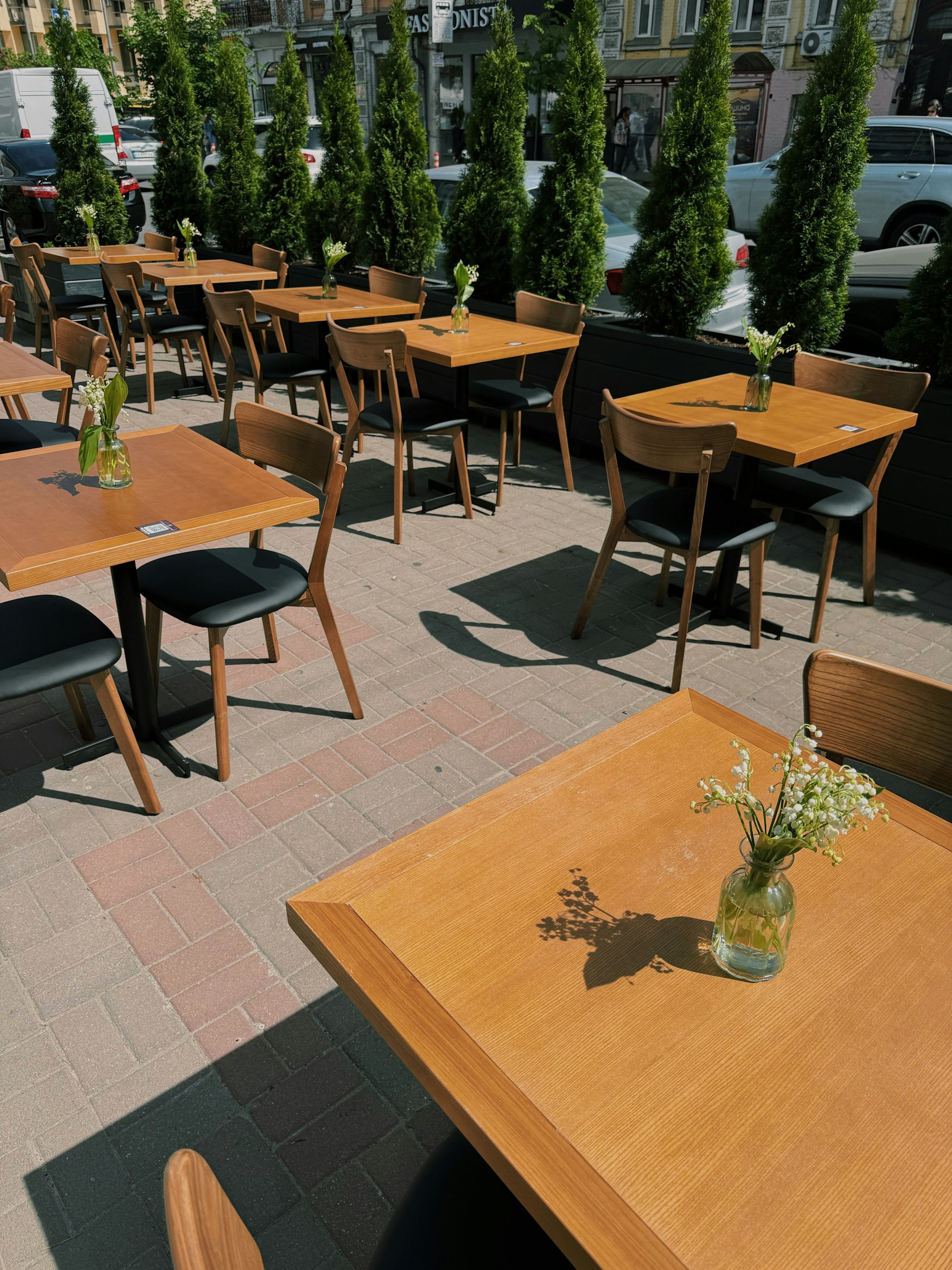 a wooden table with a vase of flowers on top of it