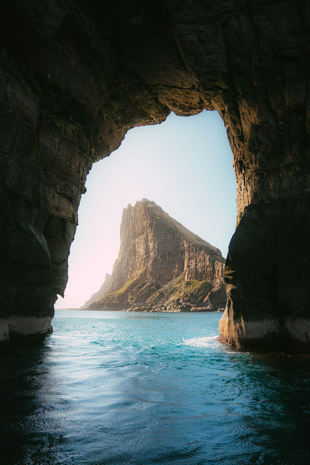 a view of a large body of water with a mountain in the background