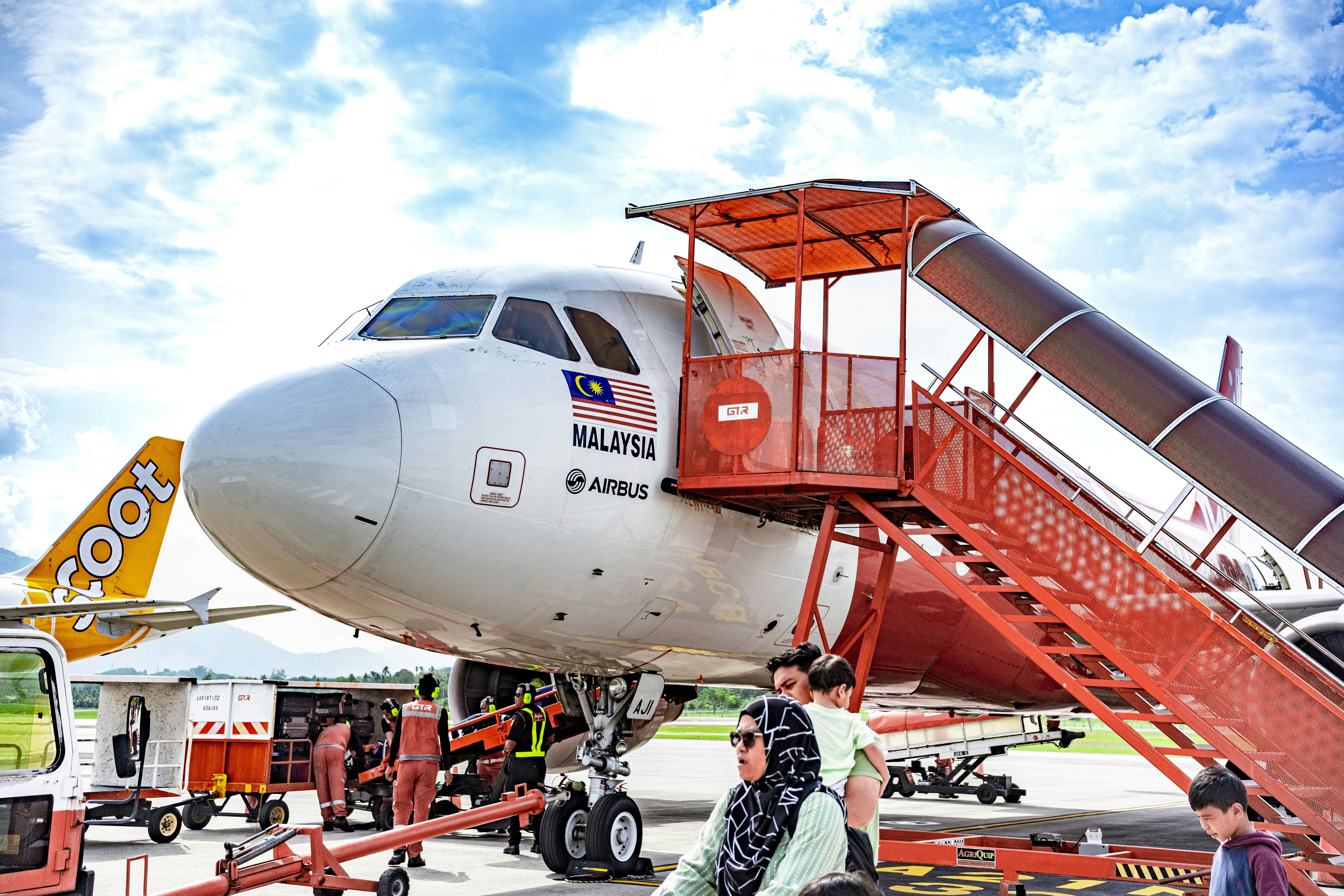 a large jetliner sitting on top of an airport tarmac