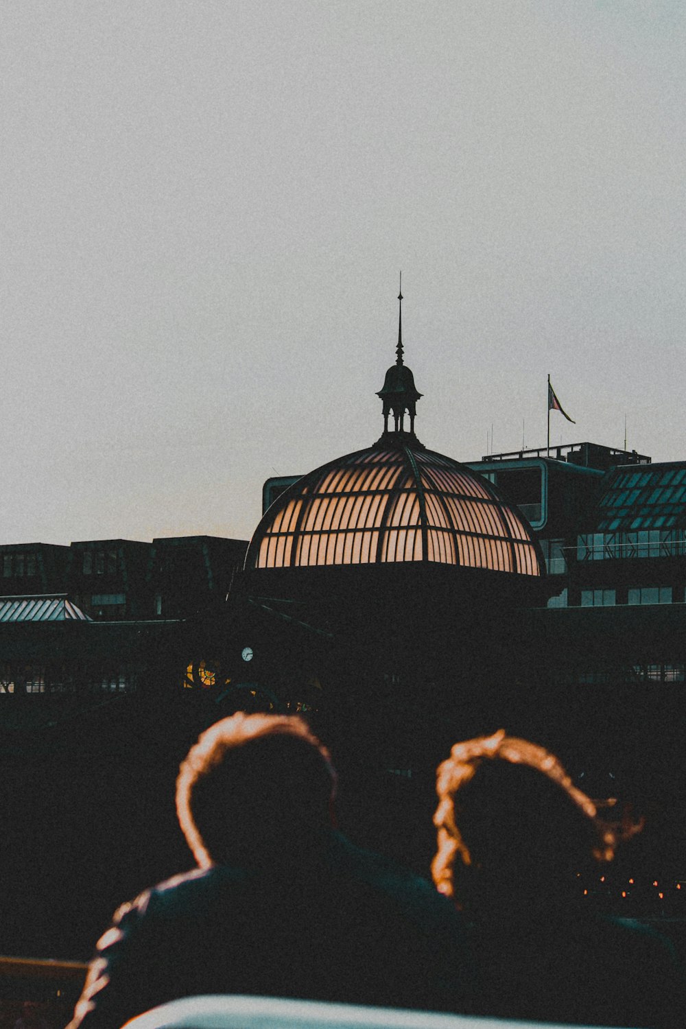 a group of people standing in front of a building