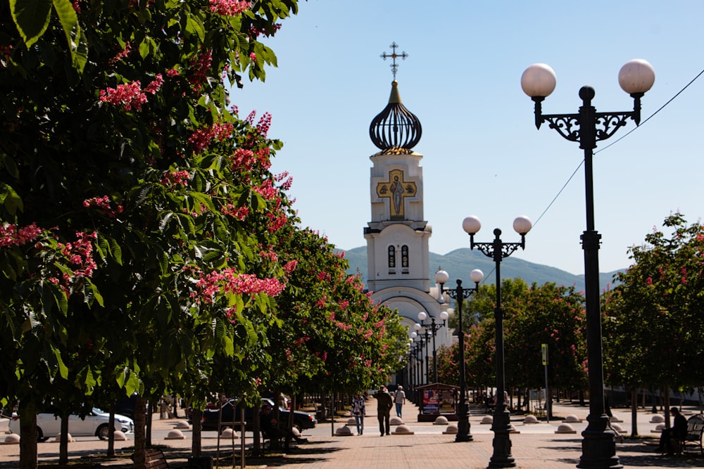 a church tower towering over a city street