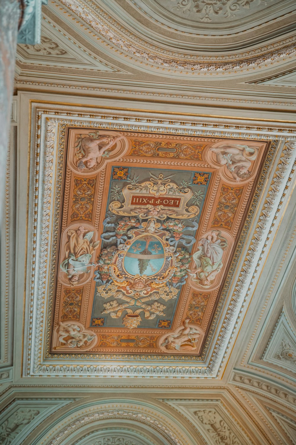 the ceiling of a building with a painting on it