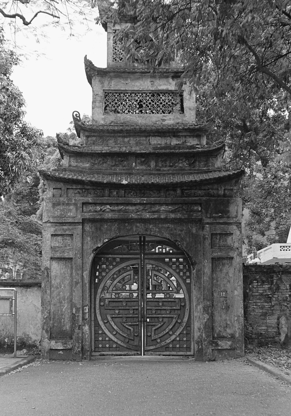 a black and white photo of a gate