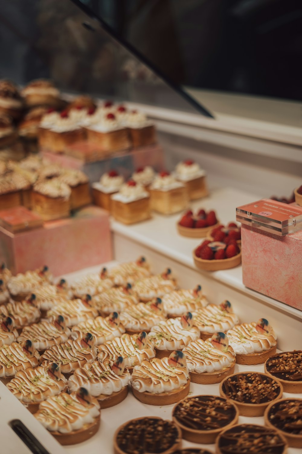 a display case filled with lots of pastries