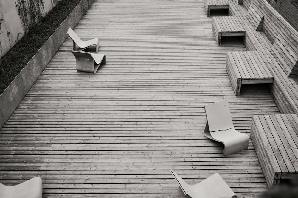 a black and white photo of some chairs and benches