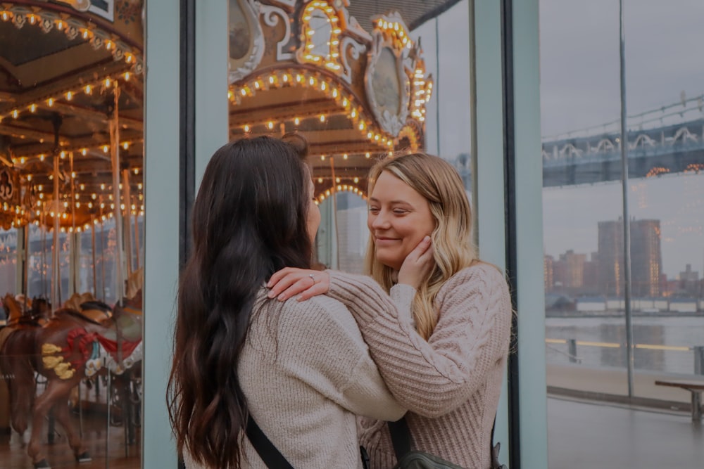 a couple of women standing next to each other