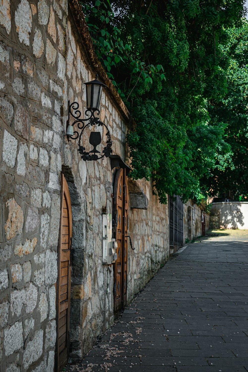 a stone building with a clock on the side of it