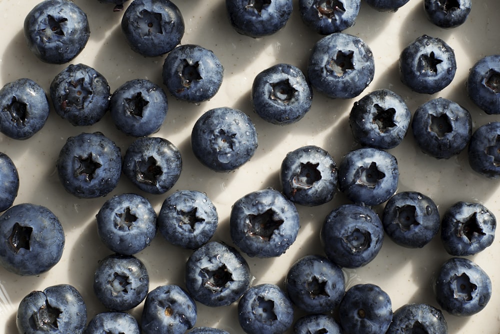 a bunch of blueberries that are on a table