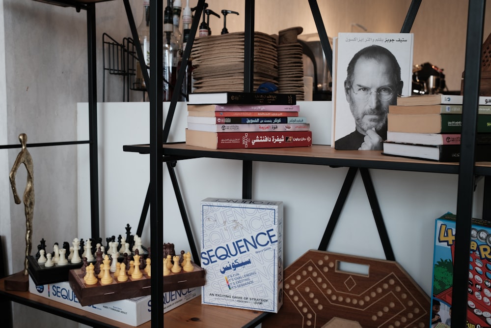 a book shelf filled with books and chess pieces