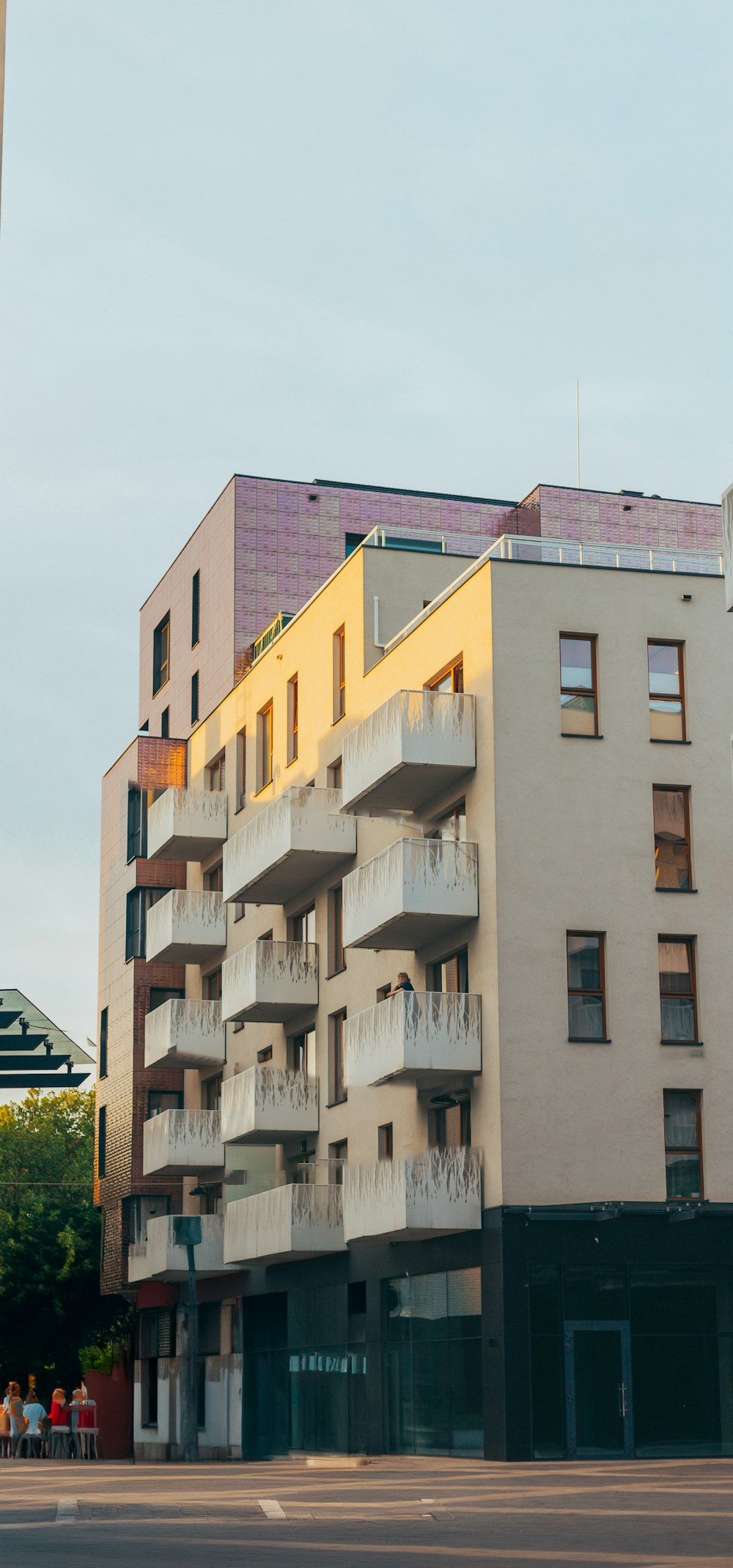 a tall building with balconies and balconies on the top of it