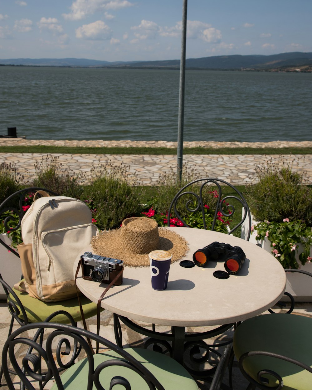 a table with a hat and a bag on it