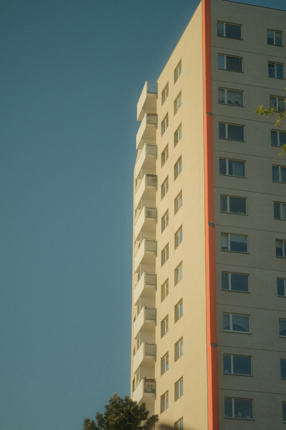 a tall white building sitting next to a tall white building