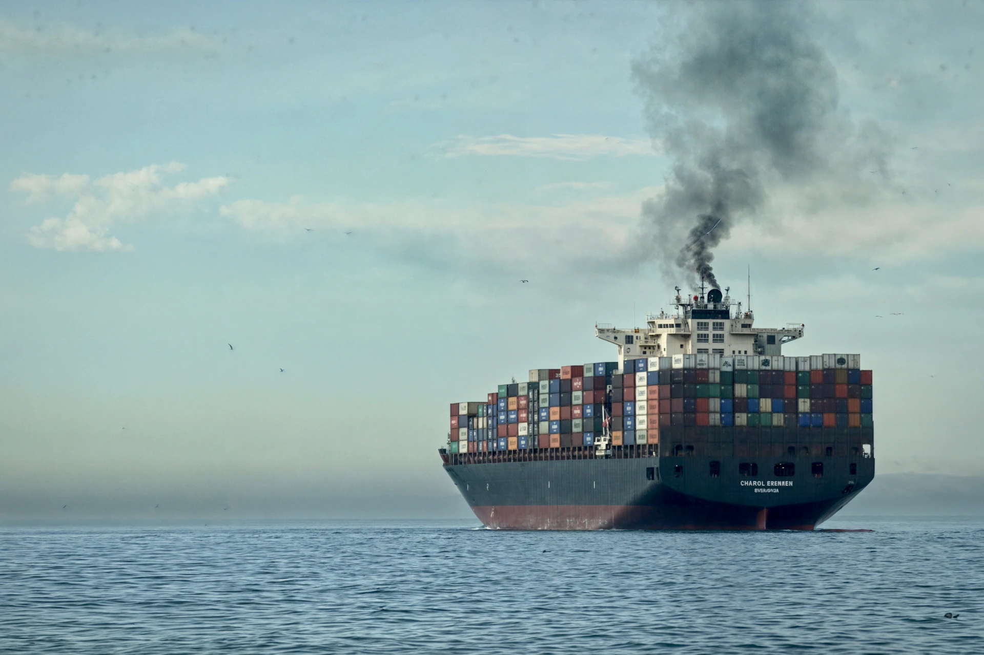 a large cargo ship in the middle of the ocean