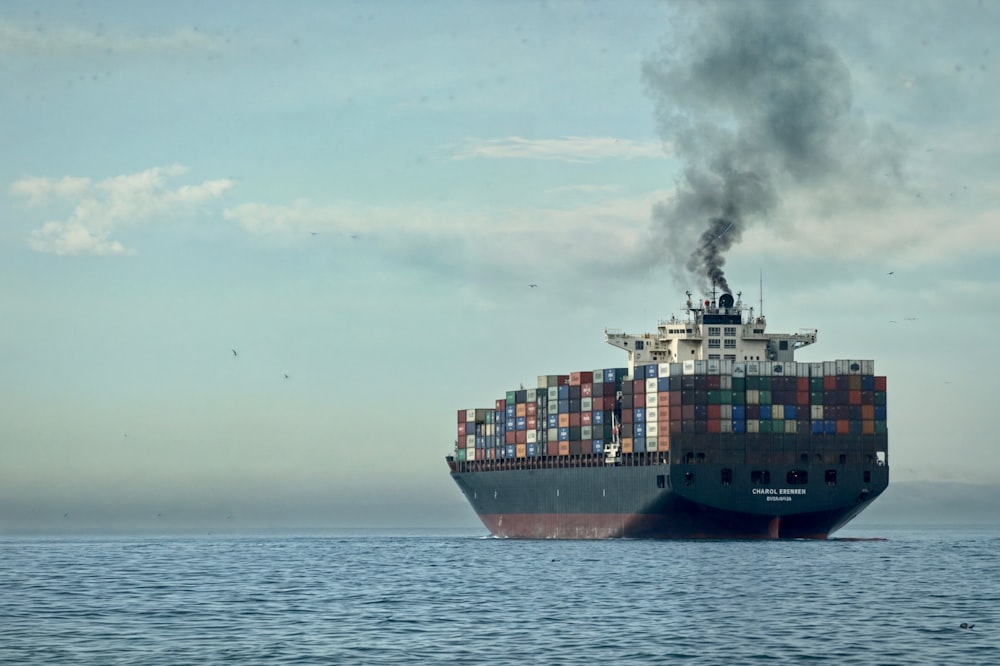 a large cargo ship in the middle of the ocean