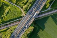 an aerial view of a highway with cars on it