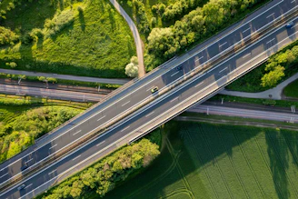 an aerial view of a highway and a bridge