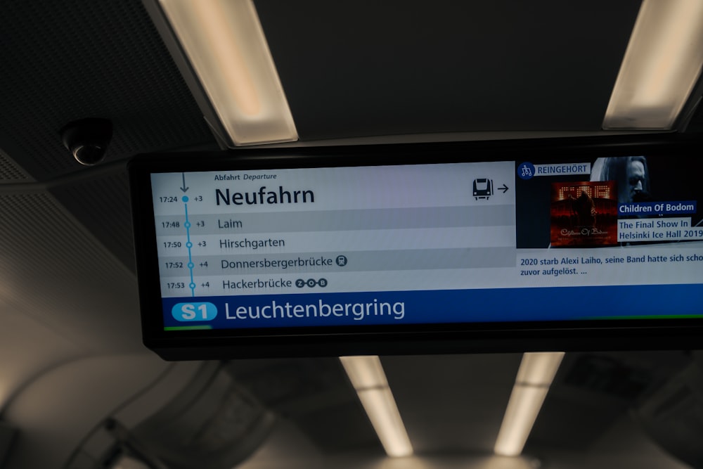 a large screen in a train with a lot of information on it