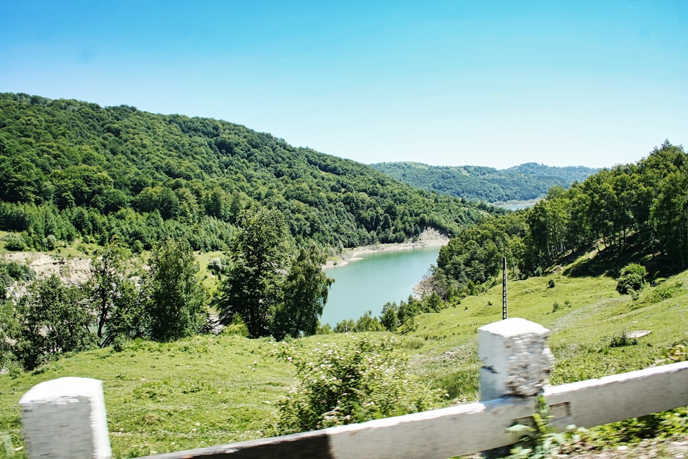 a view of a lake from a hill top