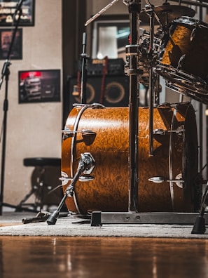 a drum set up in a recording studio