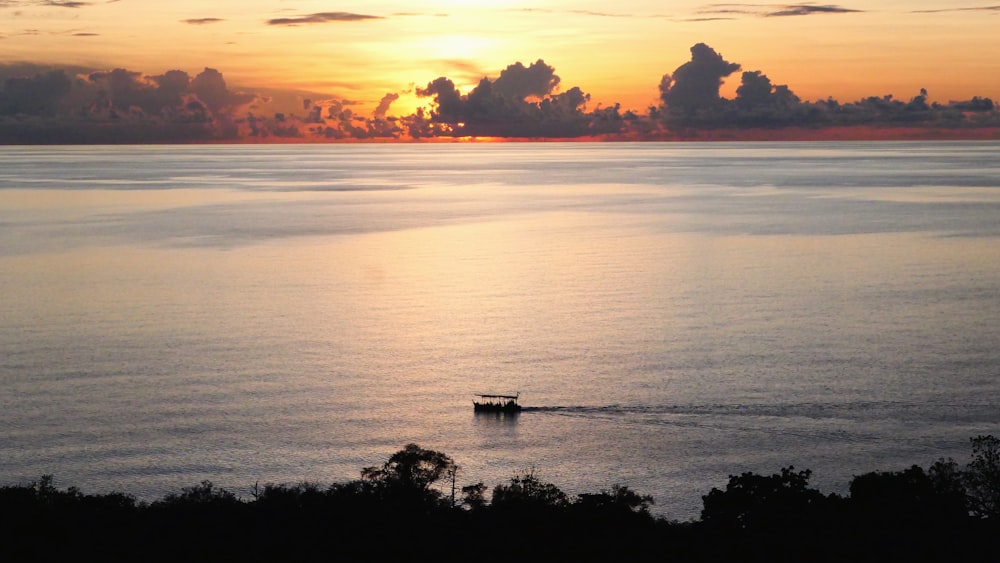 a boat in the middle of a large body of water