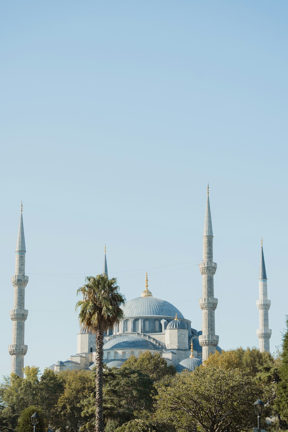 a large white building with a blue dome