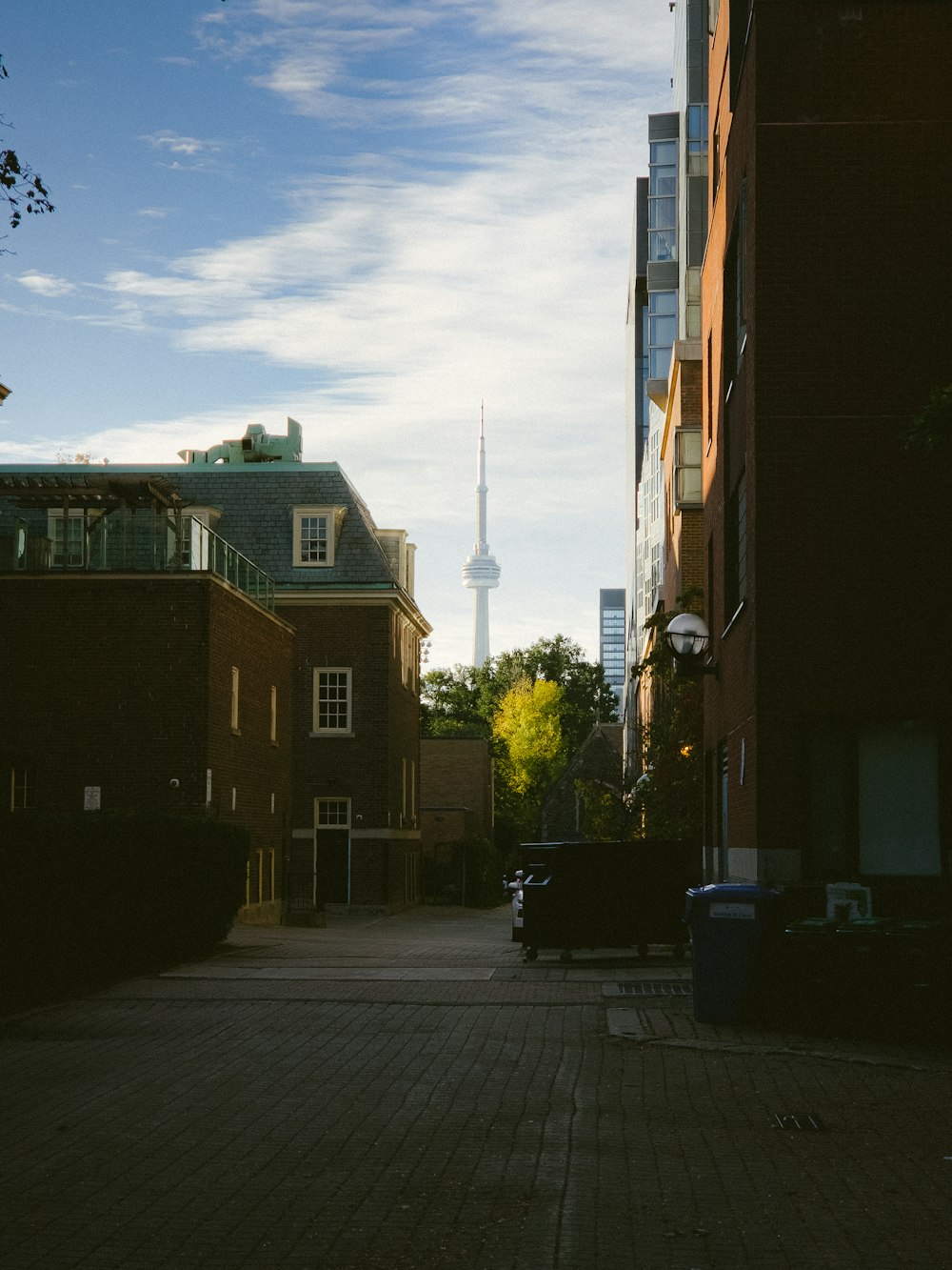 a view of a city street with a clock tower in the background