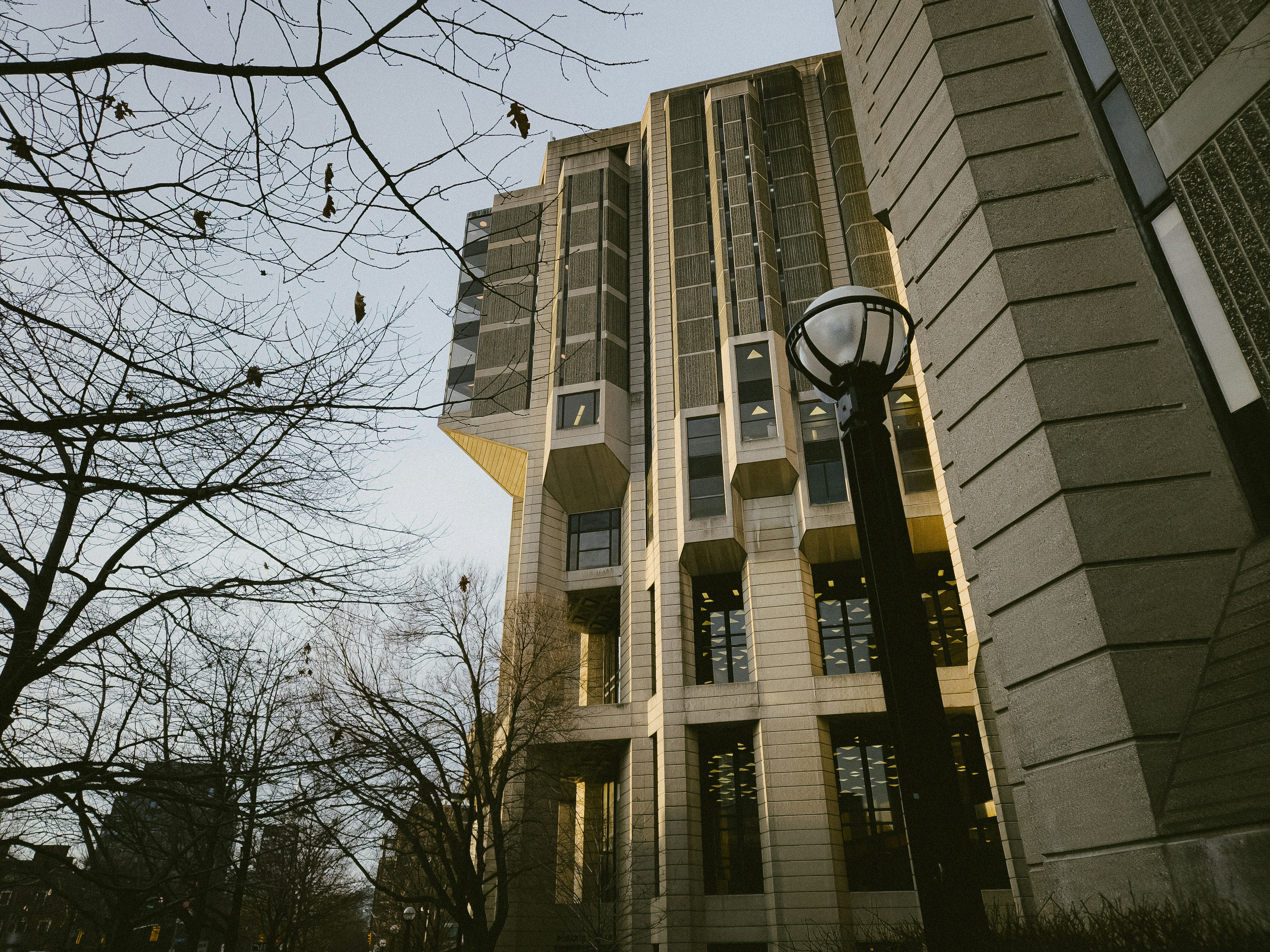 a tall building with a street light in front of it