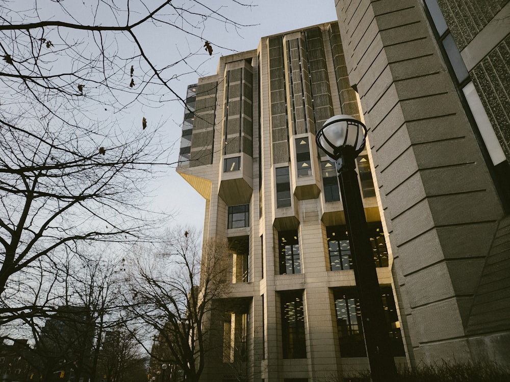 a tall building with a street light in front of it