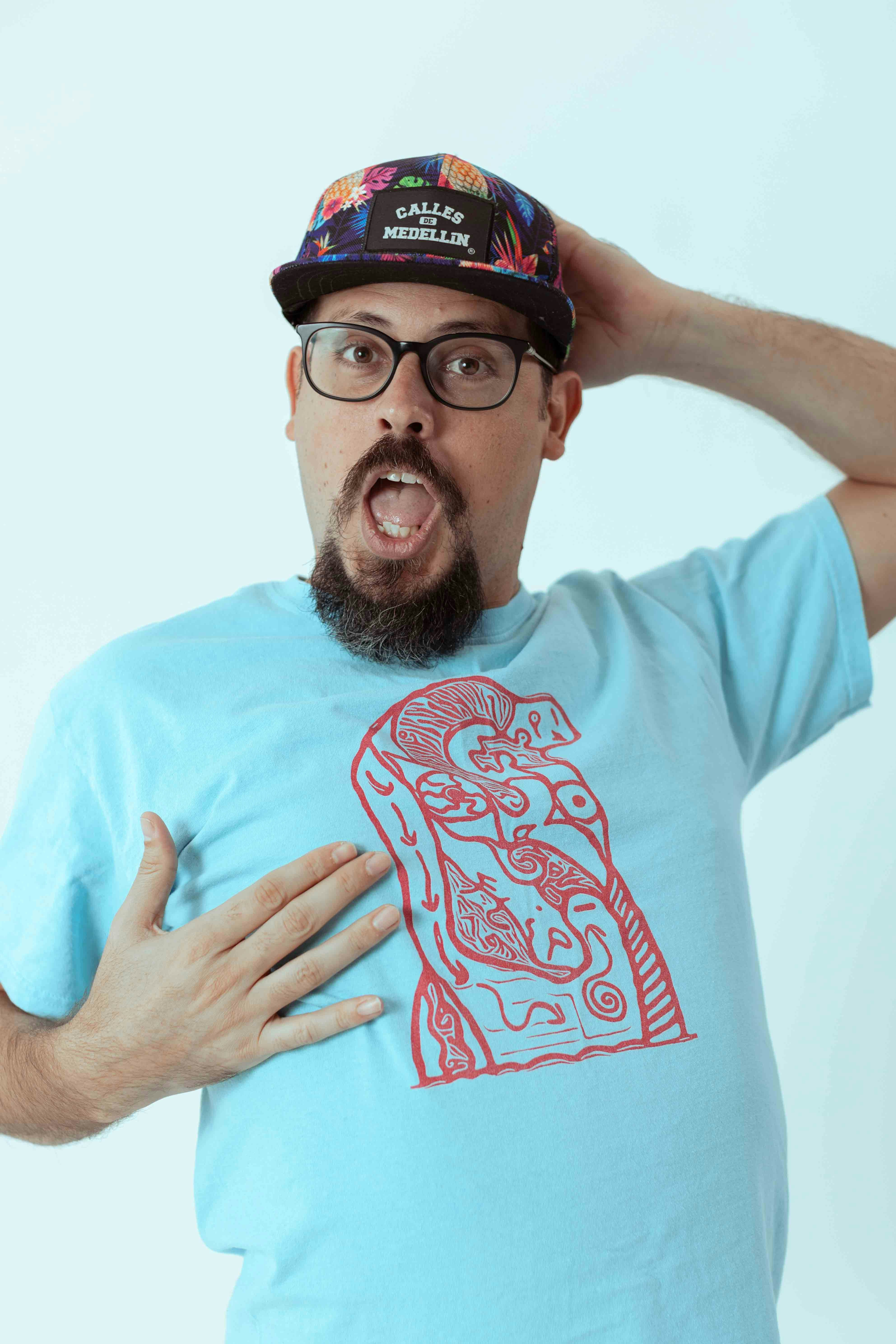 a man wearing a blue shirt and a hat