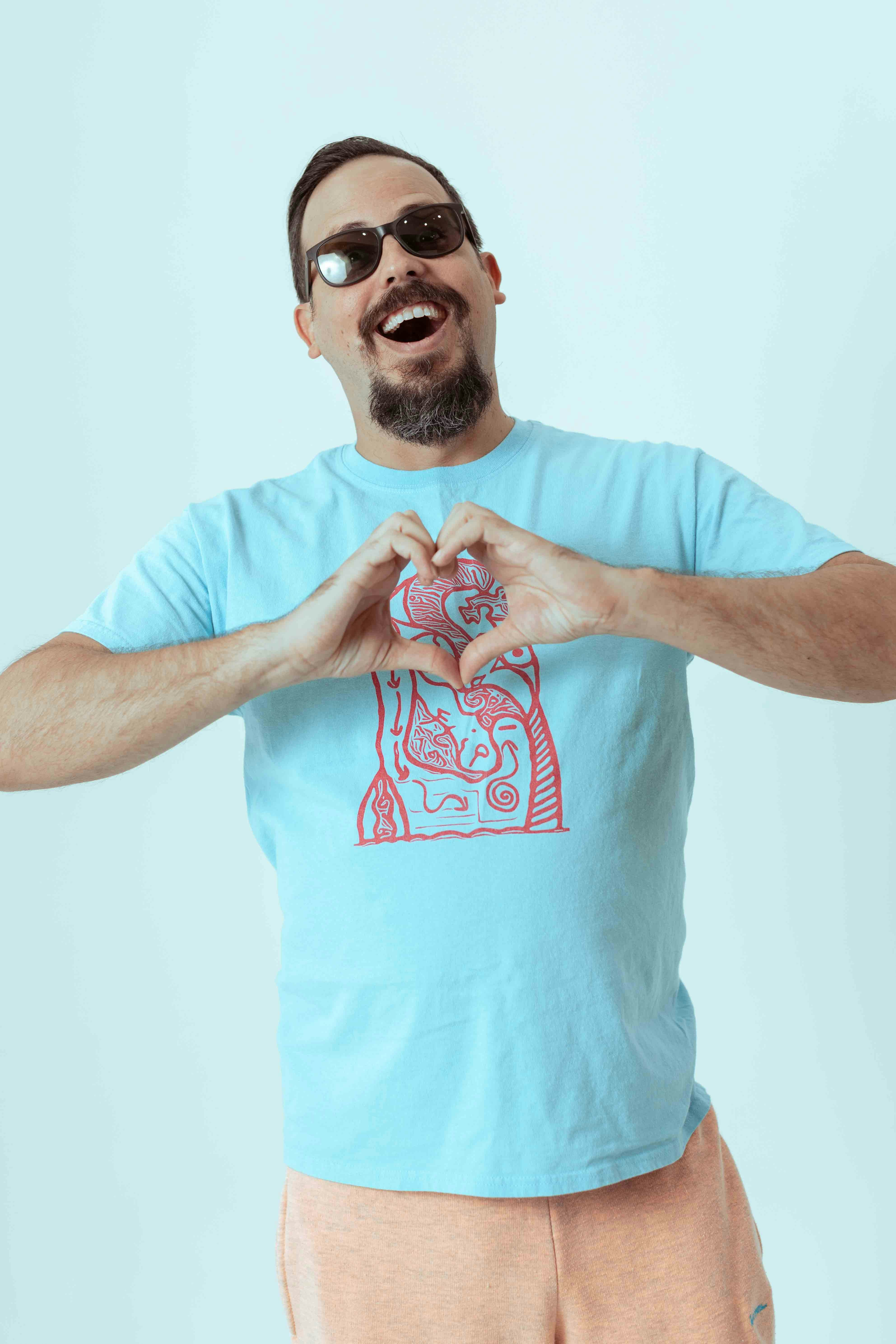a man making a heart with his hands