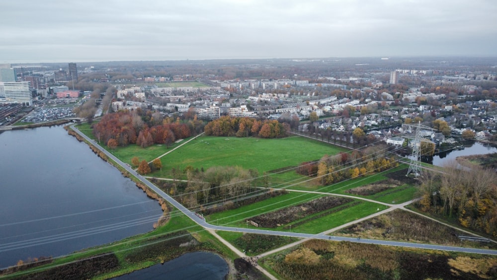 an aerial view of a city and a lake