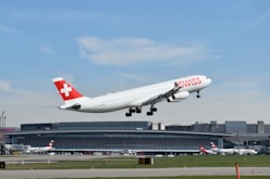 a large passenger jet taking off from an airport runway
