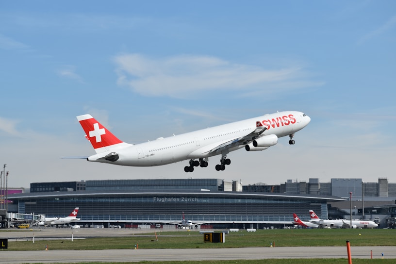 a large passenger jet taking off from an airport runway