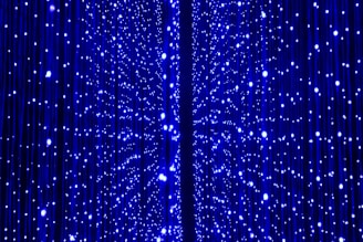 a blue curtain with white dots on it