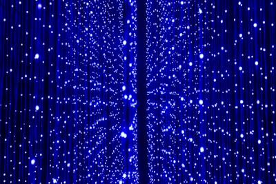 a blue curtain with white dots on it