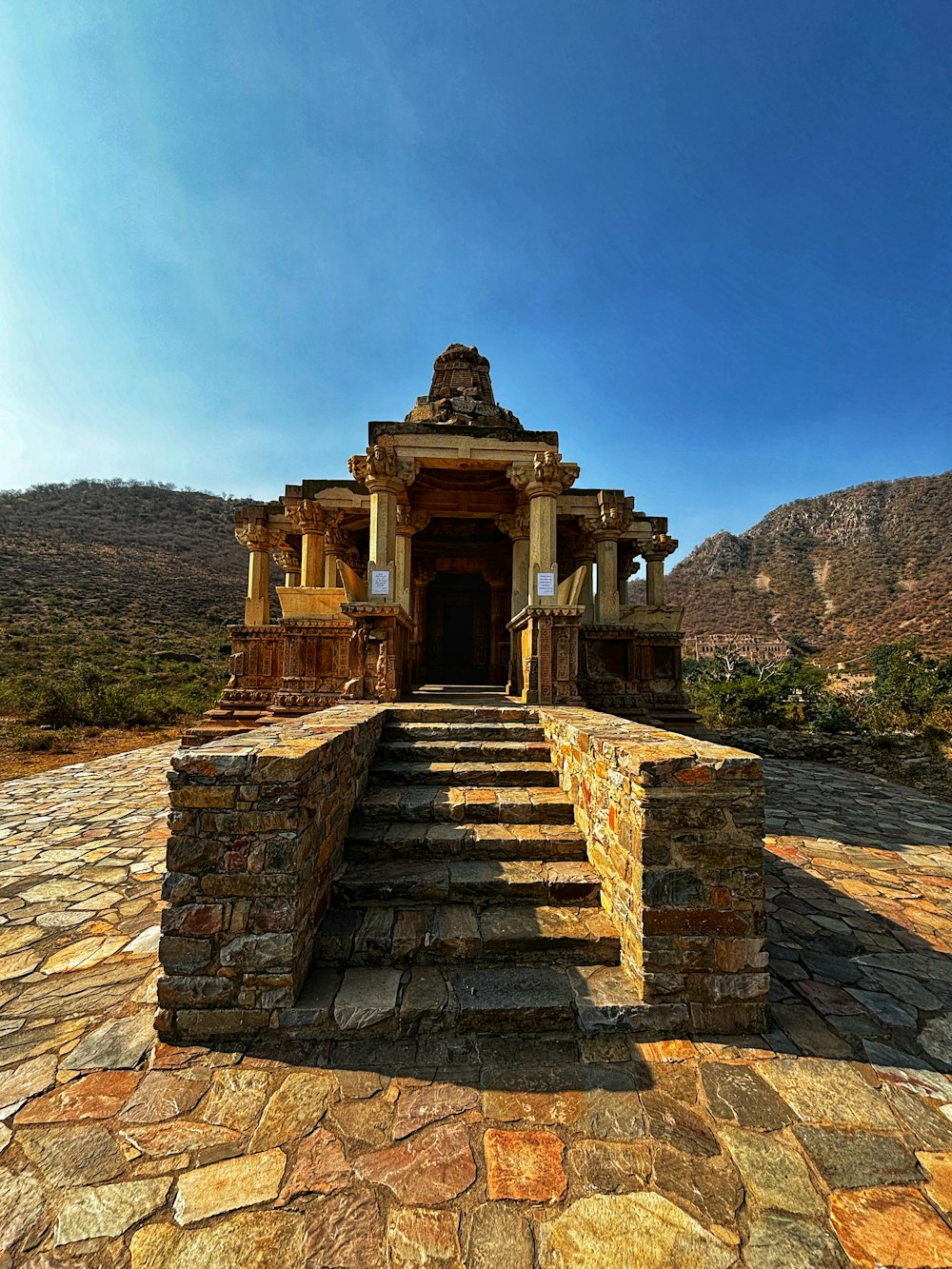 a stone building with steps leading up to it